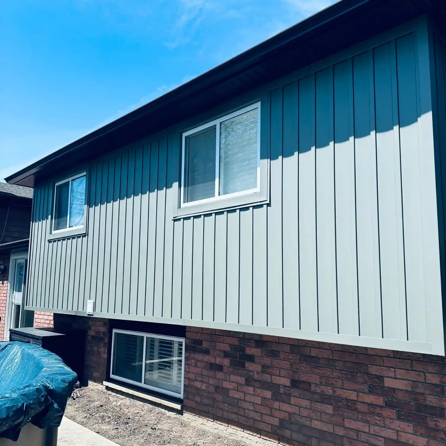 Quality board and batten vinyl siding installation in brantford Ontario, grey